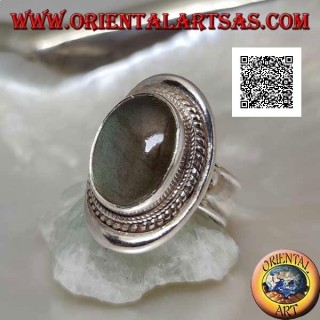 Silver ring with oval cabochon labradorite surrounded by intertwining on a smooth shield (20b)