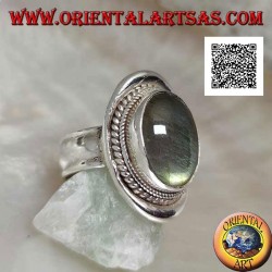 Silver ring with oval cabochon labradorite surrounded by intertwining on a smooth shield (20b)