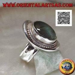 Silver ring with oval cabochon labradorite surrounded by intertwining on a smooth shield (20b)