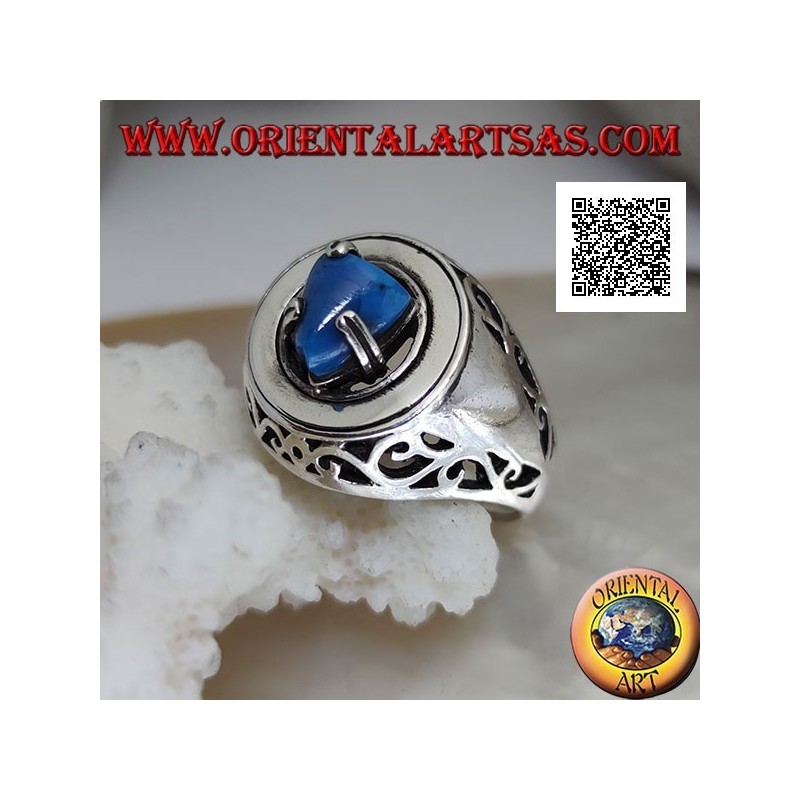 Silver ring with turquoise pyramid set on a smooth disc with floral openwork on the sides
