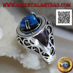Silver ring with turquoise pyramid set on a smooth disc with floral openwork on the sides