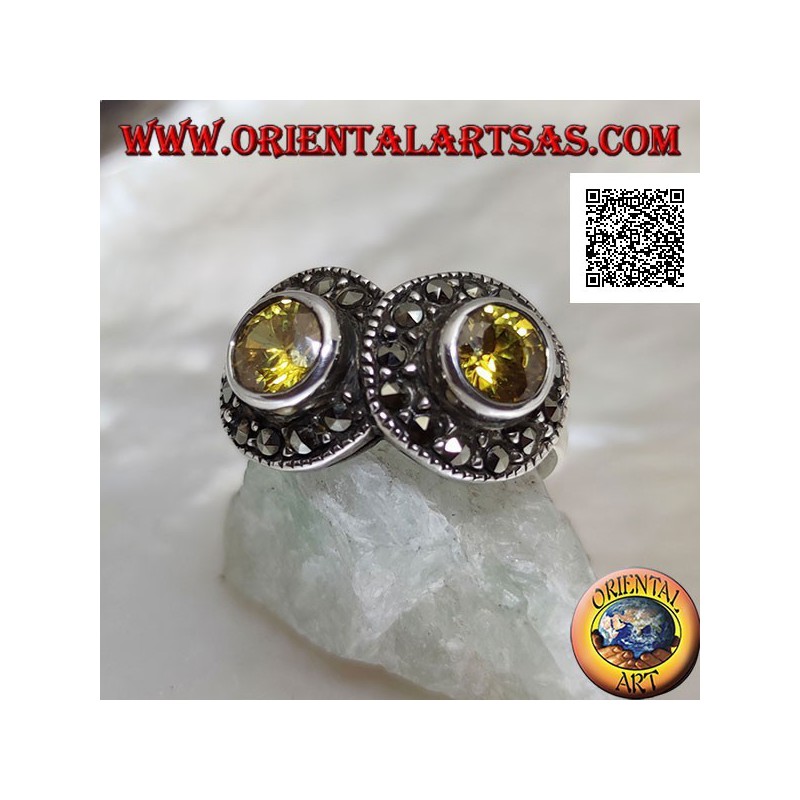 Silver ring with two round yellow topazes in two circles studded with marcasite intersecting each other