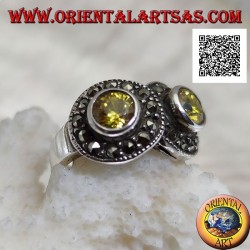 Silver ring with two round yellow topazes in two circles studded with marcasite intersecting each other