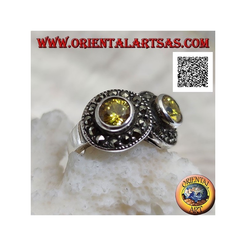 Bague en argent avec deux topazes rondes jaunes en deux cercles parsemés de marcassite se croisant