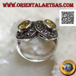 Bague en argent avec deux topazes rondes jaunes en deux cercles parsemés de marcassite se croisant
