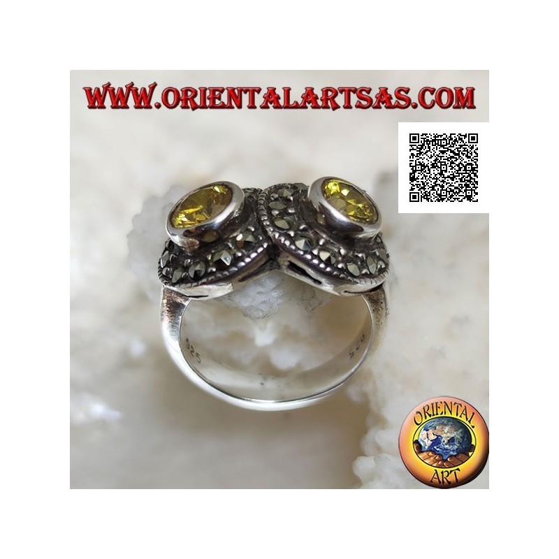 Anello in argento con due topazi gialli tondi in due cerchi tempestati di marcassite intersecati tra loro