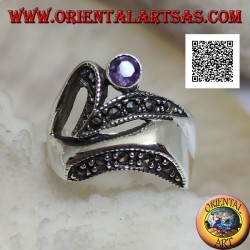 Silver ring of abstract shape in futuristic style with parts of marcasite and round amethyst
