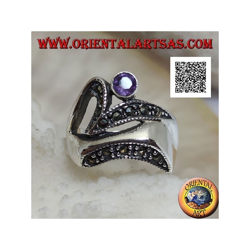 Silver ring of abstract shape in futuristic style with parts of marcasite and round amethyst