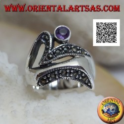 Silver ring of abstract shape in futuristic style with parts of marcasite and round amethyst