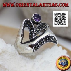 Silver ring of abstract shape in futuristic style with parts of marcasite and round amethyst