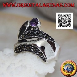 Silver ring of abstract shape in futuristic style with parts of marcasite and round amethyst