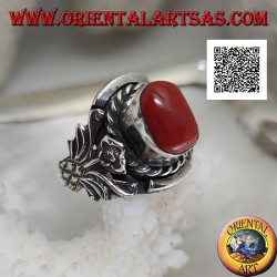 Silver ring with oval Tibetan antique coral with interweaving and integral flower on the sides