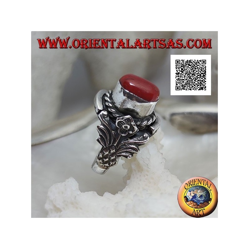 Silver ring with oval Tibetan antique coral with interweaving and integral flower on the sides
