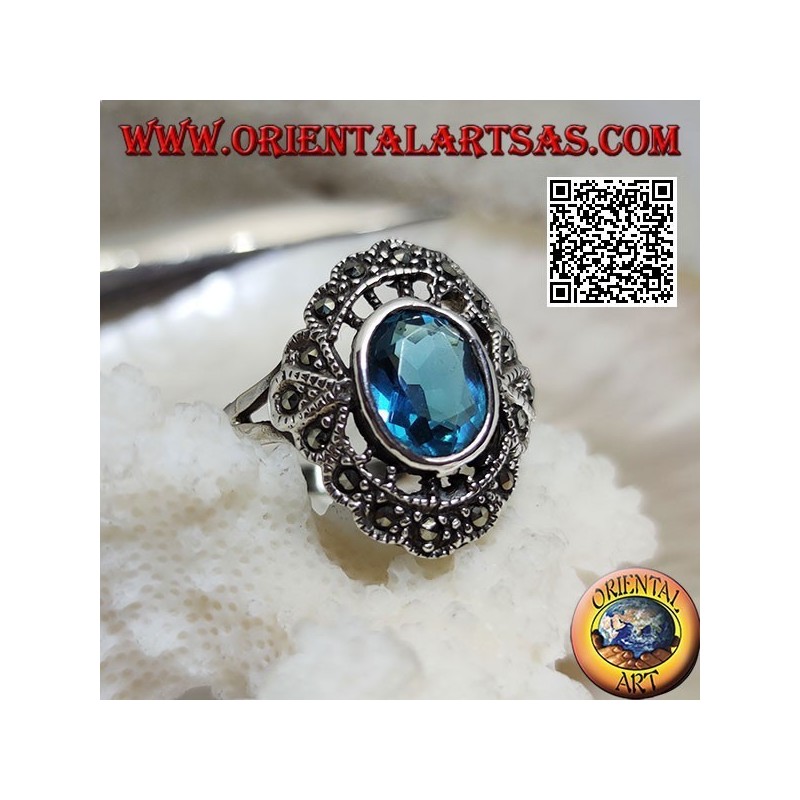 Anillo nube de plata con topacio azul ovalado y marcasita
