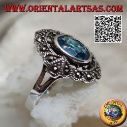 Anillo nube de plata con topacio azul ovalado y marcasita