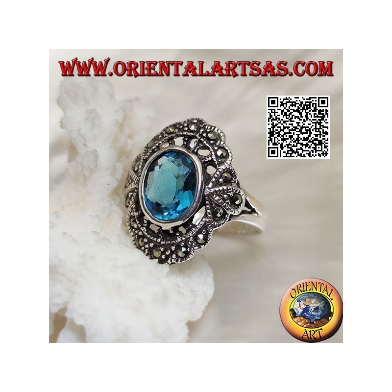 Anillo nube de plata con topacio azul ovalado y marcasita