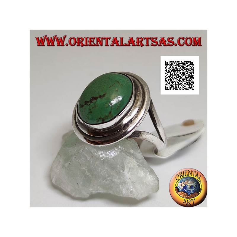 Anello in argento con turchese tibetano antico ovale con doppio bordo liscio agganciato lateralmente a due
