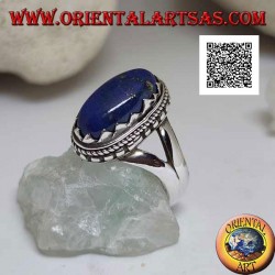 Silver ring with oval lapis lazuli set with triangles and with interweaving around
