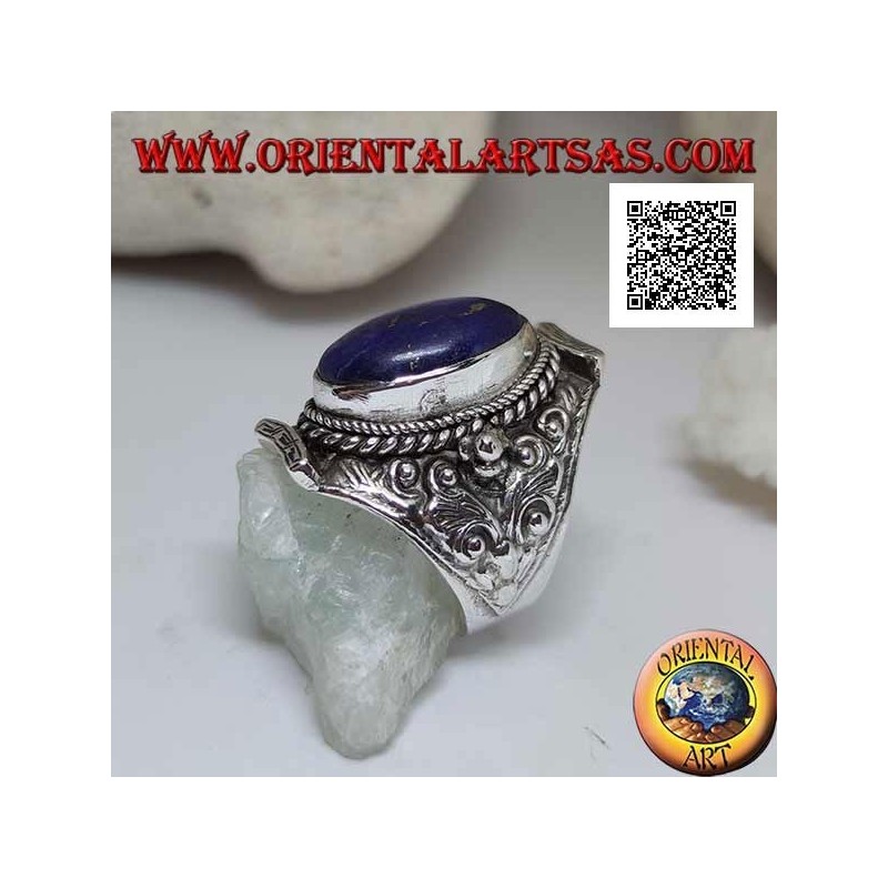 Silver ring with oval lapis lazuli on Nepalese setting and ethnic floral decoration in high relief