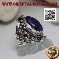 Silver ring with oval lapis lazuli on Nepalese setting and ethnic floral decoration in high relief