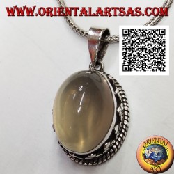Silver pendant with cabochon oval moonstone surrounded by interlacing and trio of discs
