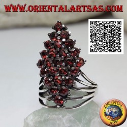 Silver ring with a rhombus of round garnets set at the bottom hooked by four wires