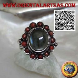 Silver flower ring with oval cabochon labradorite surrounded by Tibetan corals