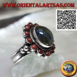 Silver flower ring with oval cabochon labradorite surrounded by Tibetan corals