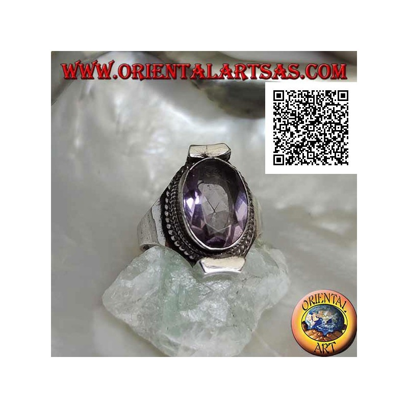 Silver ring with natural oval faceted amethyst surrounded by weaving on Nepalese setting