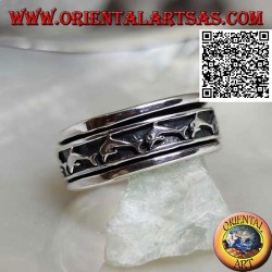 Anti-stress rotating silver ring, with a series of jumping dolphins in bas-relief