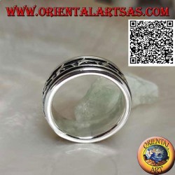 Anti-stress rotating silver ring, with a series of jumping dolphins in bas-relief