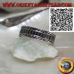 Silver ring with vertical segments between rolled cords