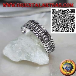 Silver ring with vertical segments between rolled cords