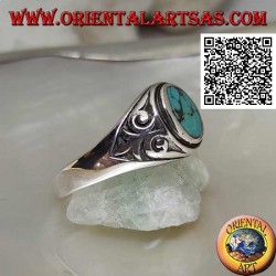 Silver ring with natural oval turquoise with imperial lily in bas-relief on the sides