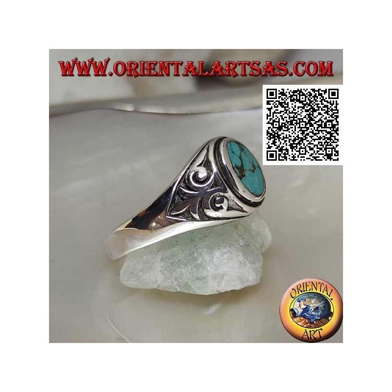 Silver ring with natural oval turquoise with imperial lily in bas-relief on the sides