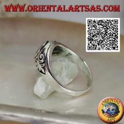 Silver ring with natural oval turquoise with imperial lily in bas-relief on the sides