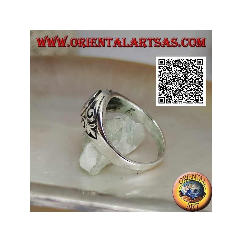 Silver ring with natural oval turquoise with imperial lily in bas-relief on the sides