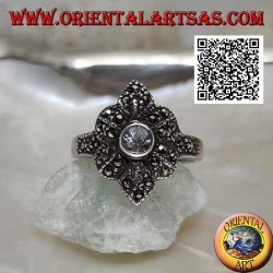 Silver ring with round aquamarine on a six-petal flower studded with marcasite