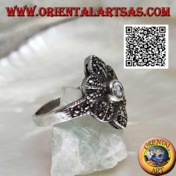 Silver ring with round aquamarine on a six-petal flower studded with marcasite