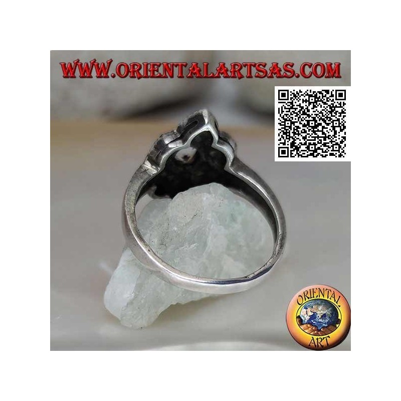 Silver ring with round aquamarine on a six-petal flower studded with marcasite