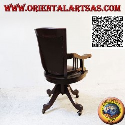 Office armchair in teak wood with upholstered seat and back upholstered in leather and wheels