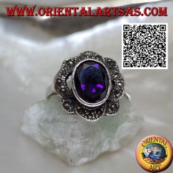 Silver ring with oval amethyst-colored zircon surrounded by wavy bands of marcasite
