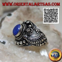 Silver ring with oval lapis lazuli and wavy beaded ethnic decoration