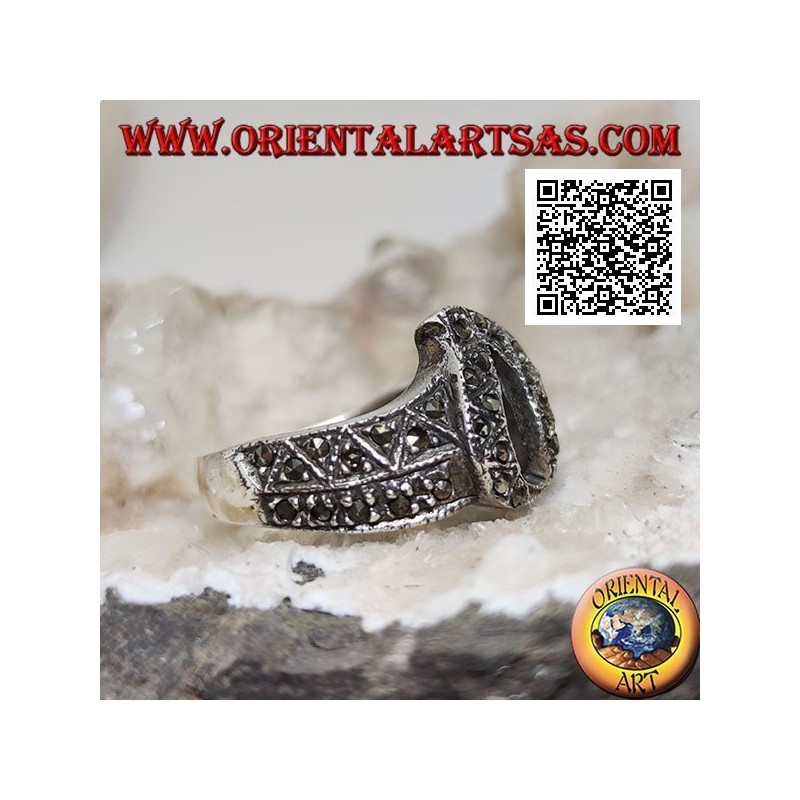 Silver band ring with central pierced flame studded with marcasite