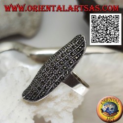 Silver ring in a large elliptical shape with a rounded center studded with marcasite