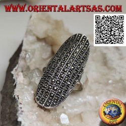 Silver ring in a large elliptical shape with a rounded center studded with marcasite