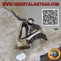Silver ring of abstract shape in futuristic style with parts of marcasite and round aquamarine