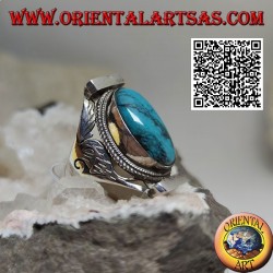 Silver ring with oval turquoise surrounded by interlacing on Nepalese setting and engravings on the sides