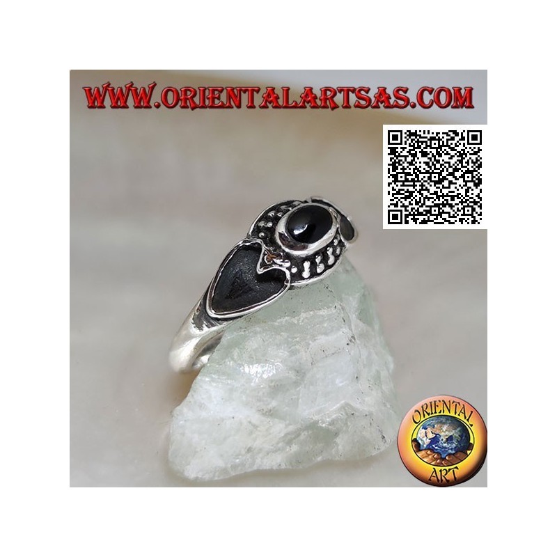 Silver ring with oval onyx surrounded by balls and heart hollowed on the sides