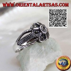 Silver ring in the shape of a flower with six petals attached to three threads studded with marcasite